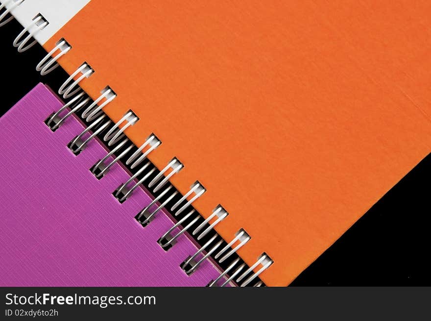 Colorful notebook as black background