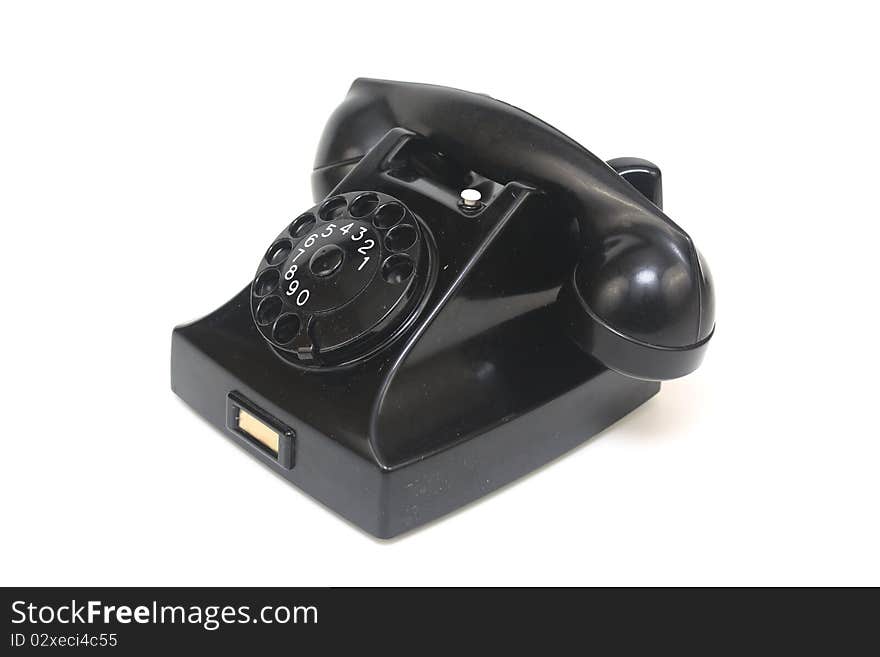 Black antique telephone side view with rotary dialling