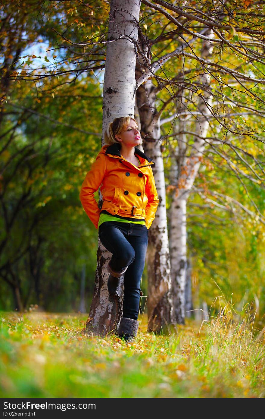 The girl in yellow in the autumn