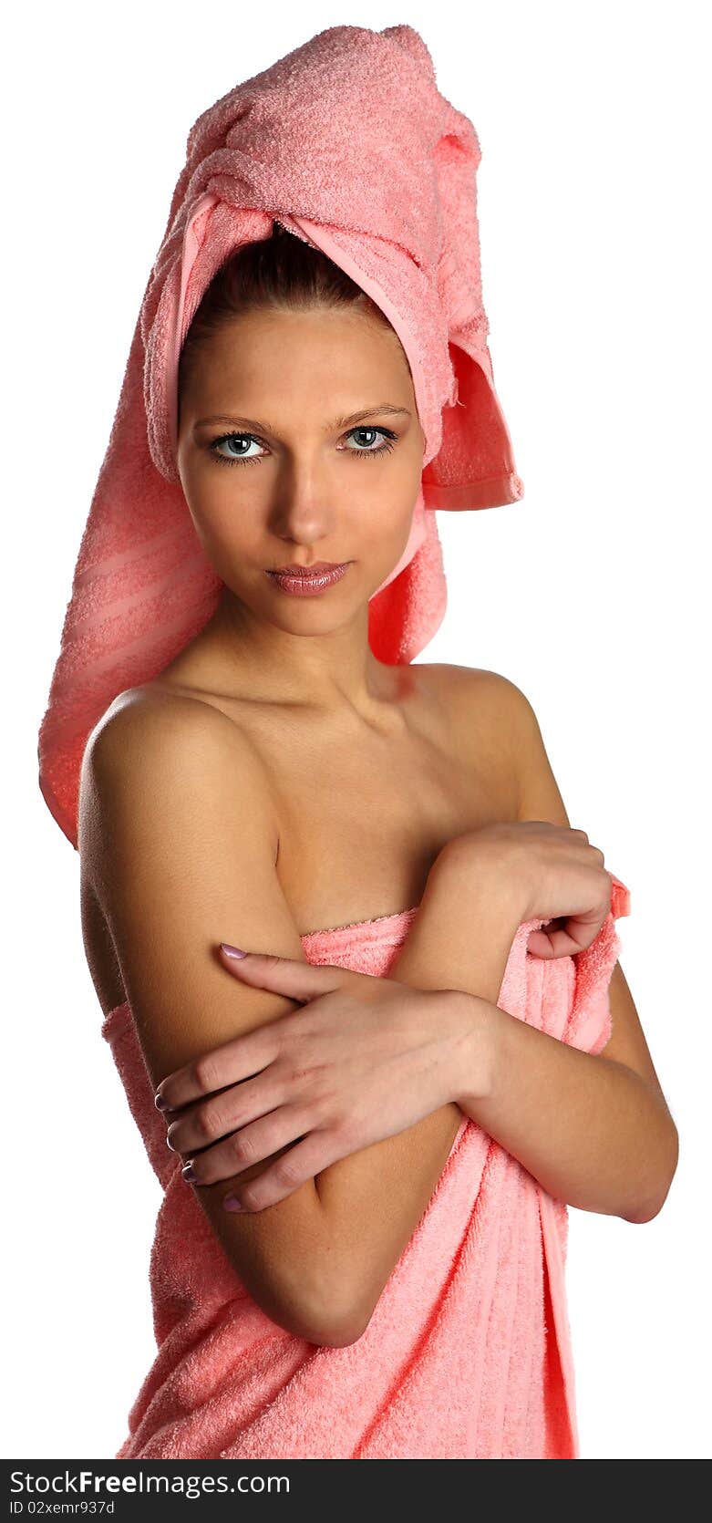 Relaxed clean woman with towel on head after spa salon