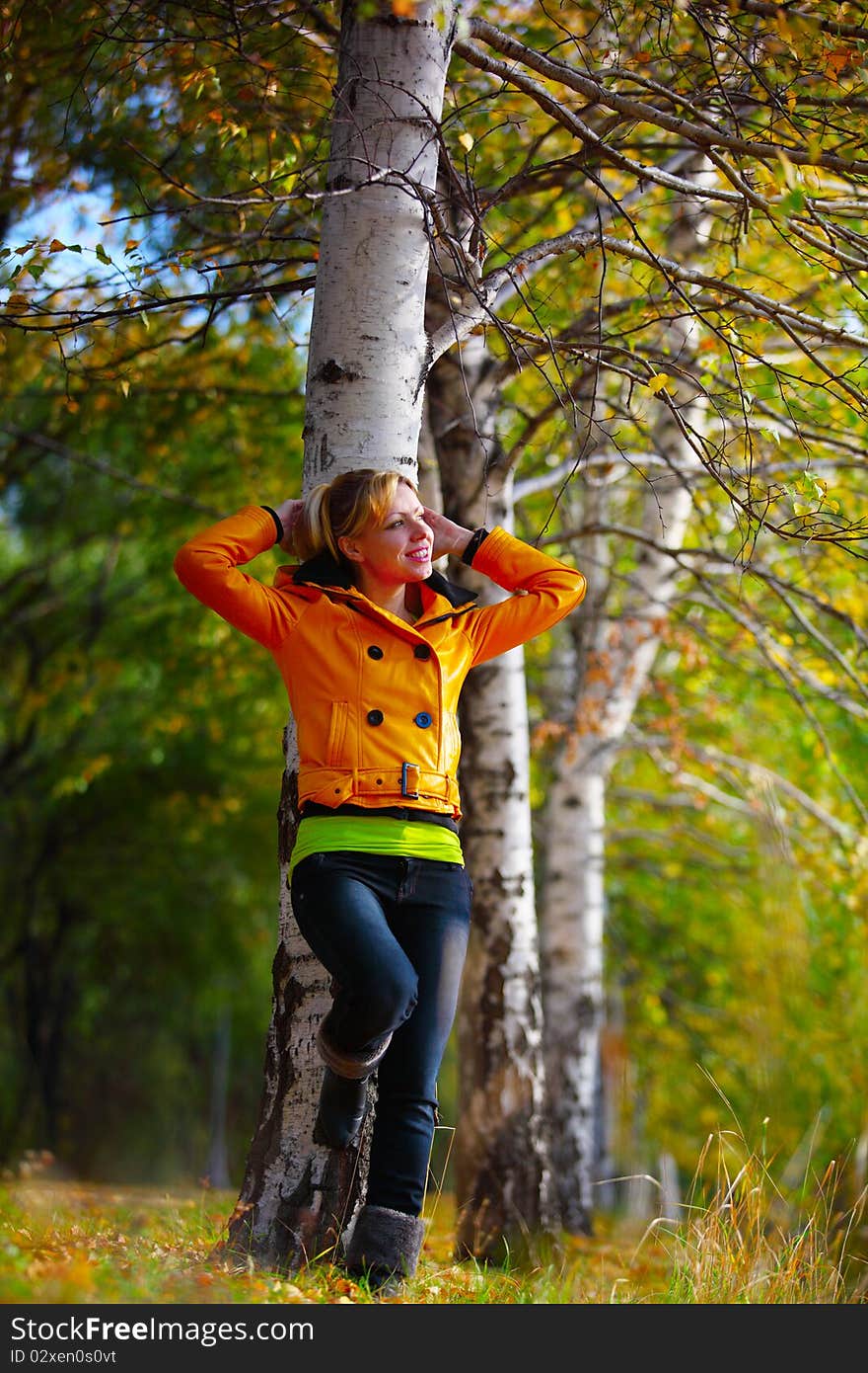 The girl in yellow in the autumn