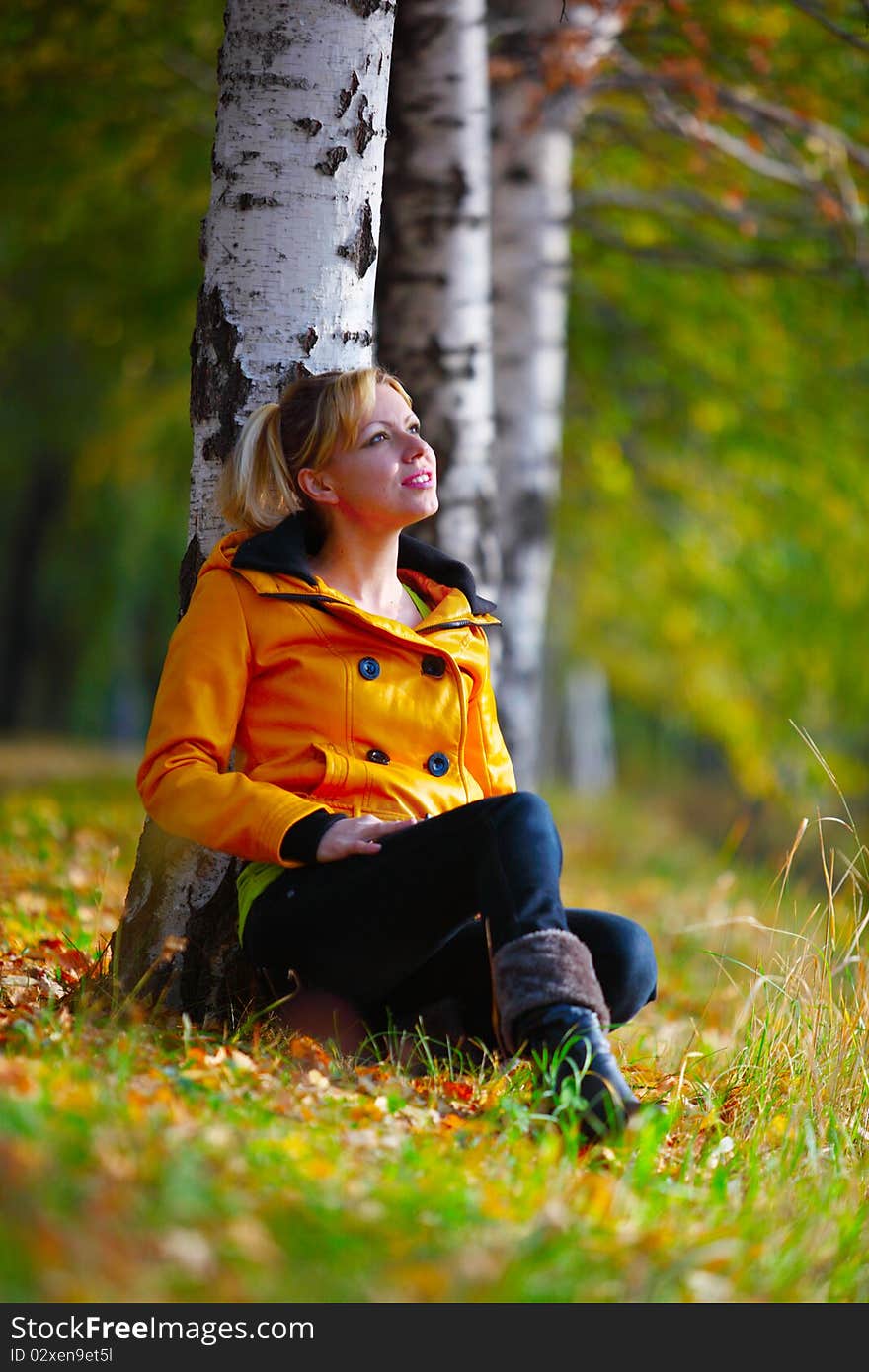 The girl in yellow in the autumn