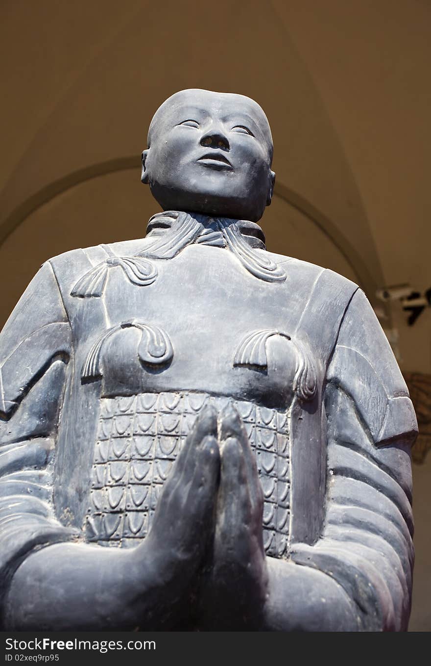 Photo of a Asian statue while praying