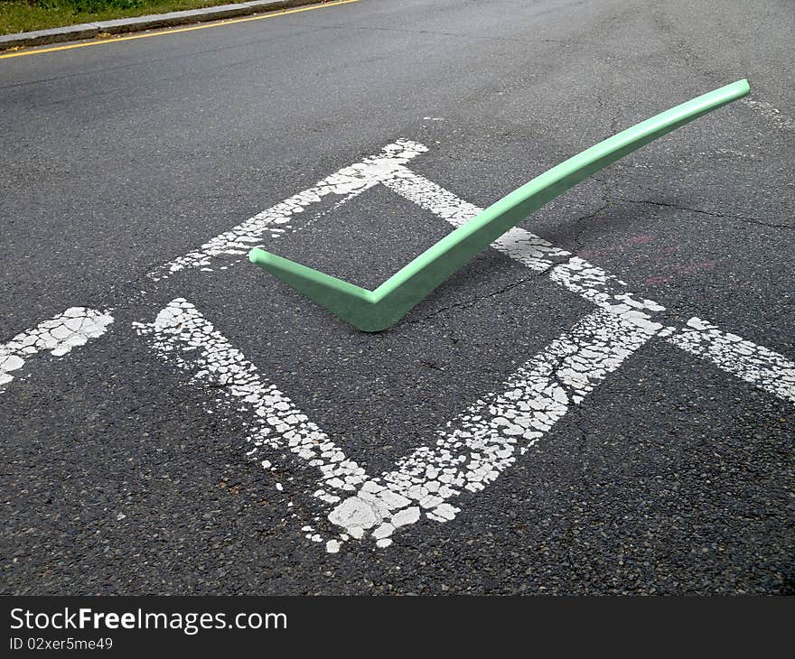 3d green check mark on pavement in painted box. 3d green check mark on pavement in painted box