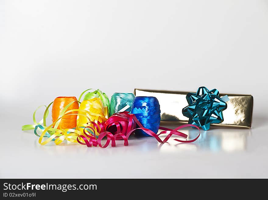 Set of colourful ribbons and a christmas  gift