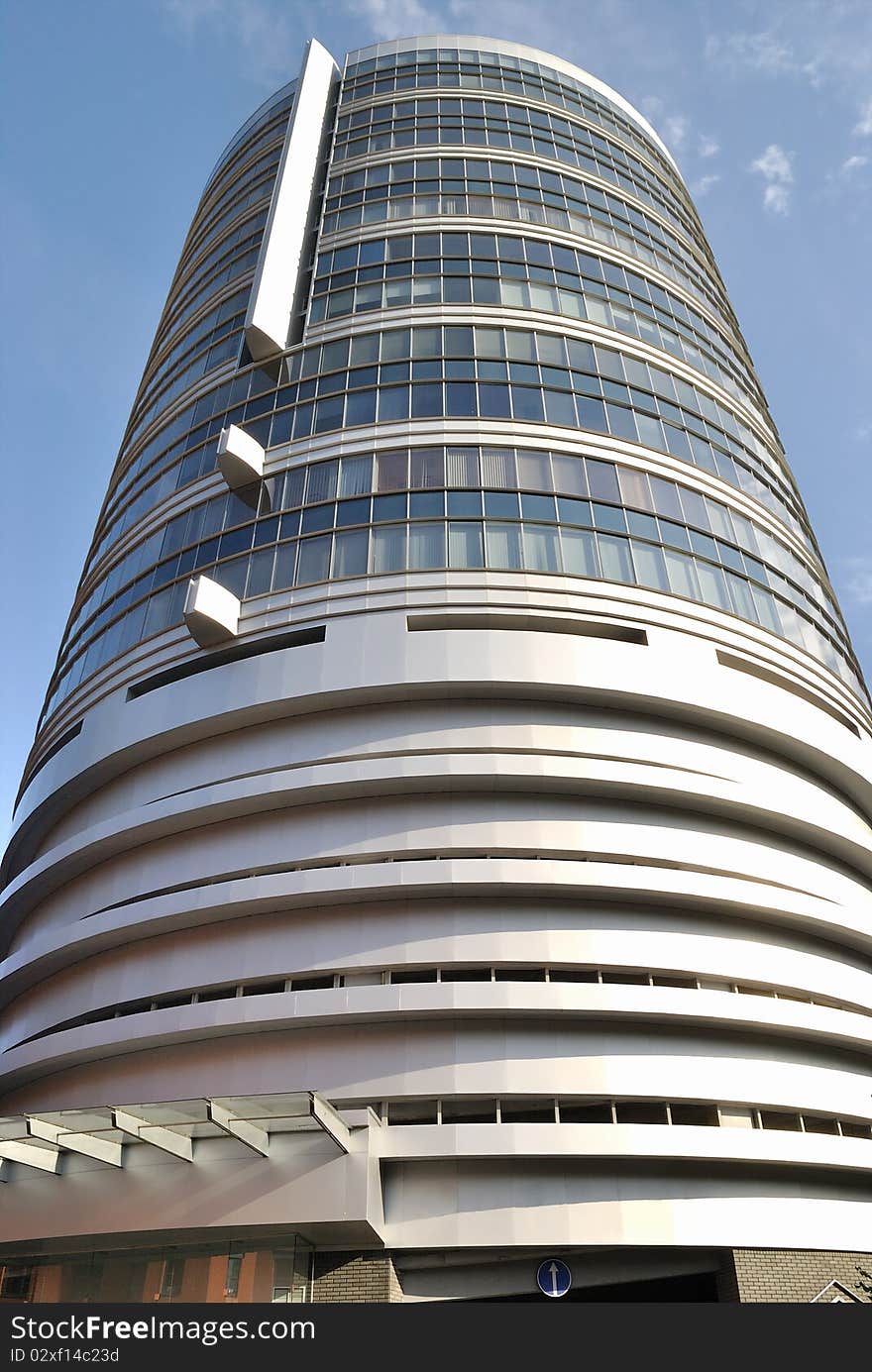 The modern building is against blue sky