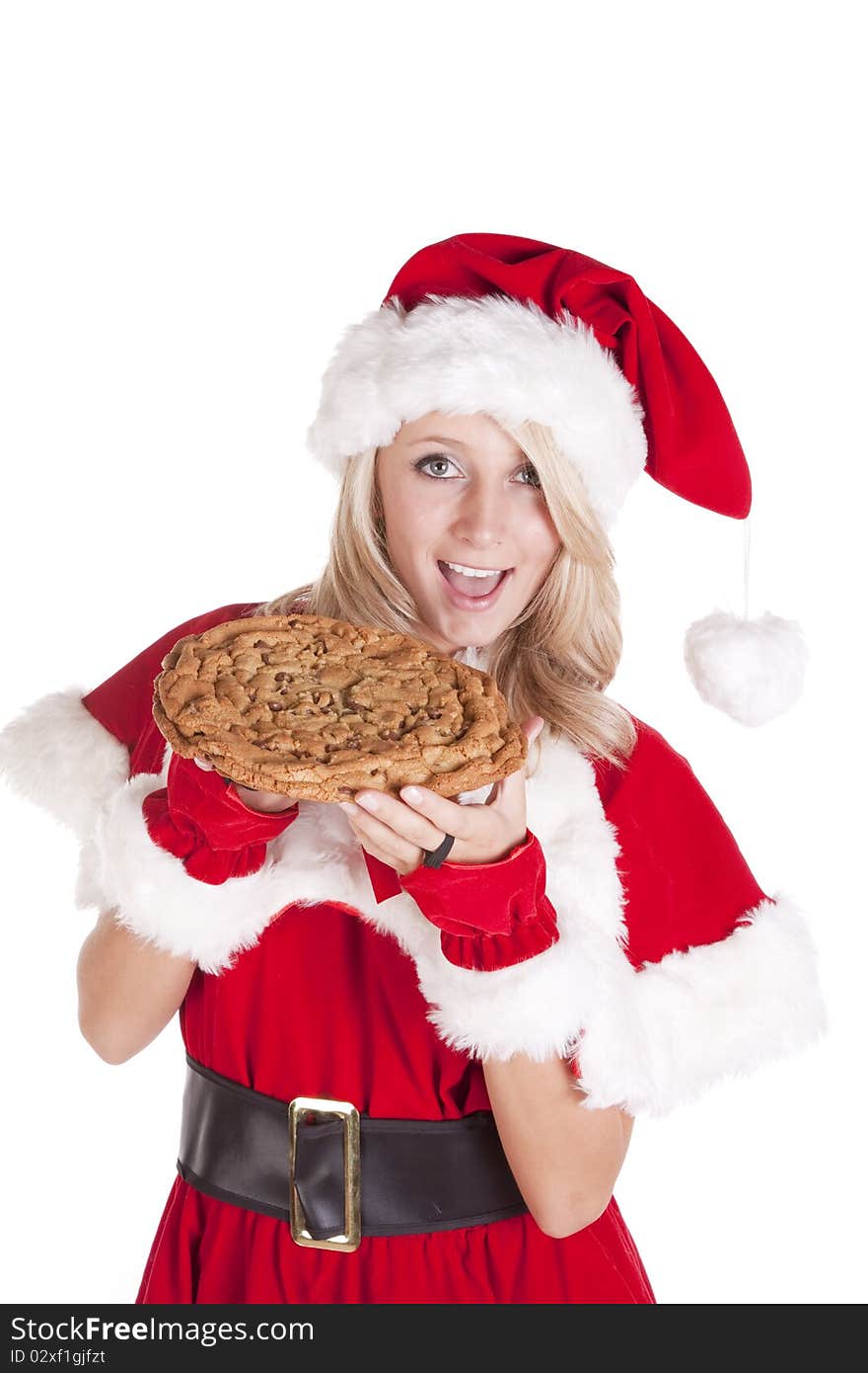 A female dressed like Santa with a big cookie. A female dressed like Santa with a big cookie.