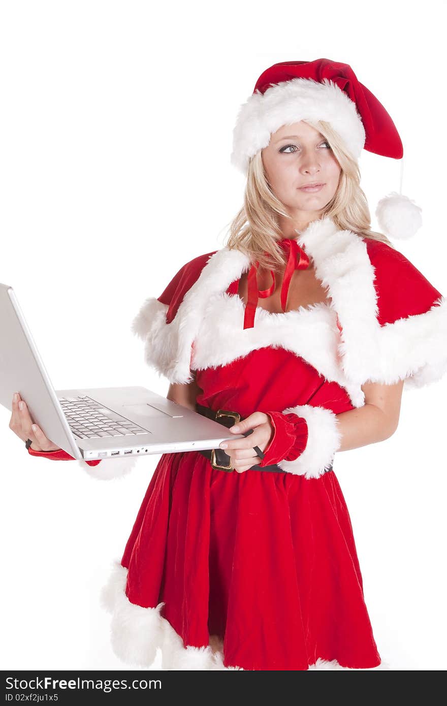 A female dressed as santas helper making a list on a laptop. A female dressed as santas helper making a list on a laptop.