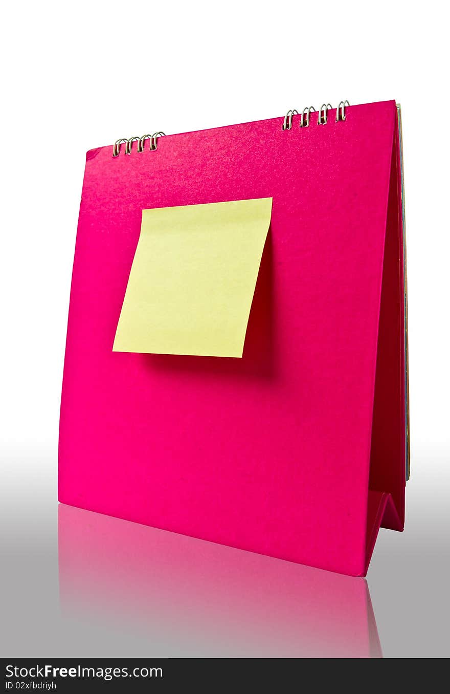 Yellow note on pink calender