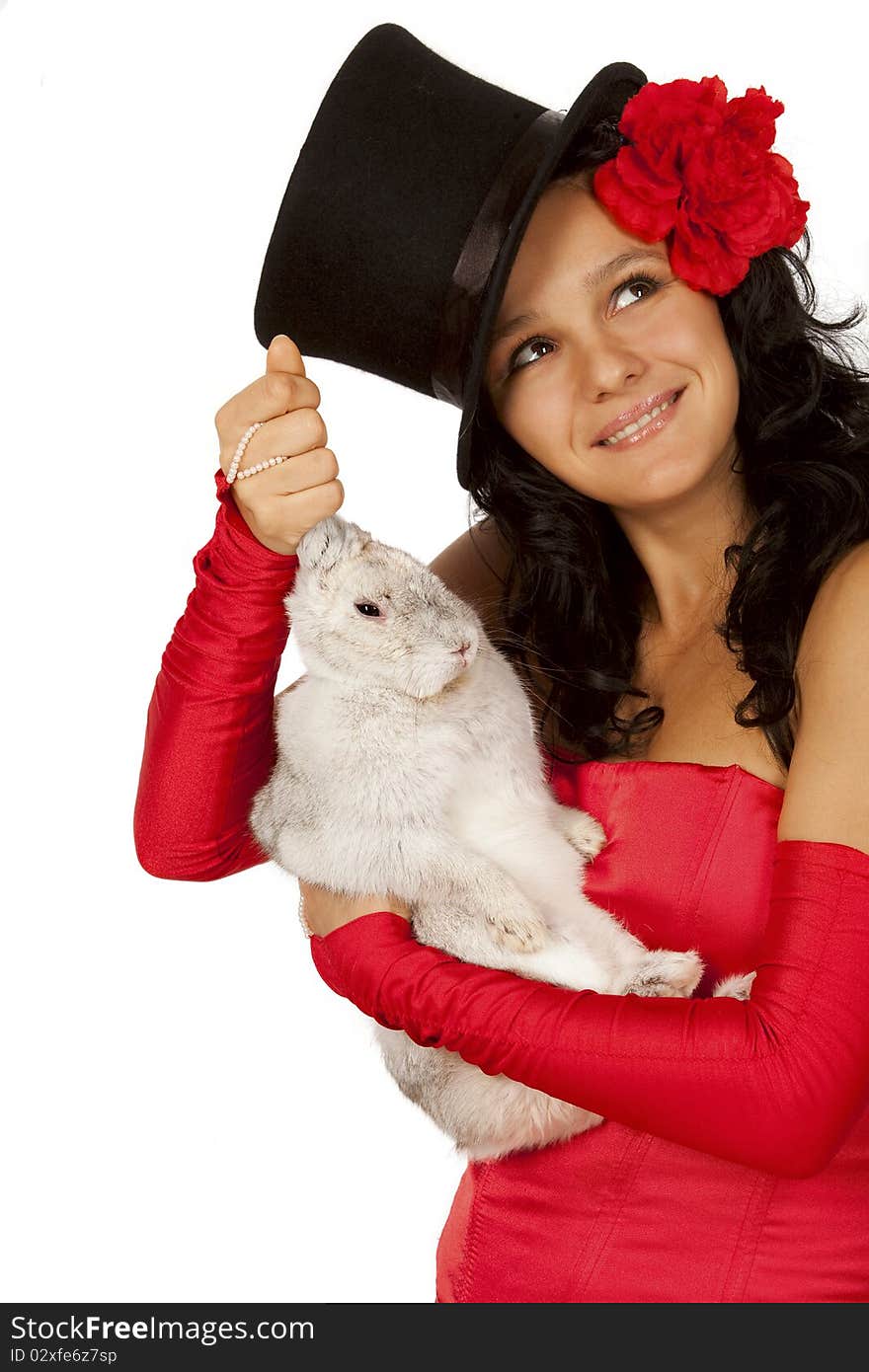 Closeup portrait of  a cute magician with  bunny against white background