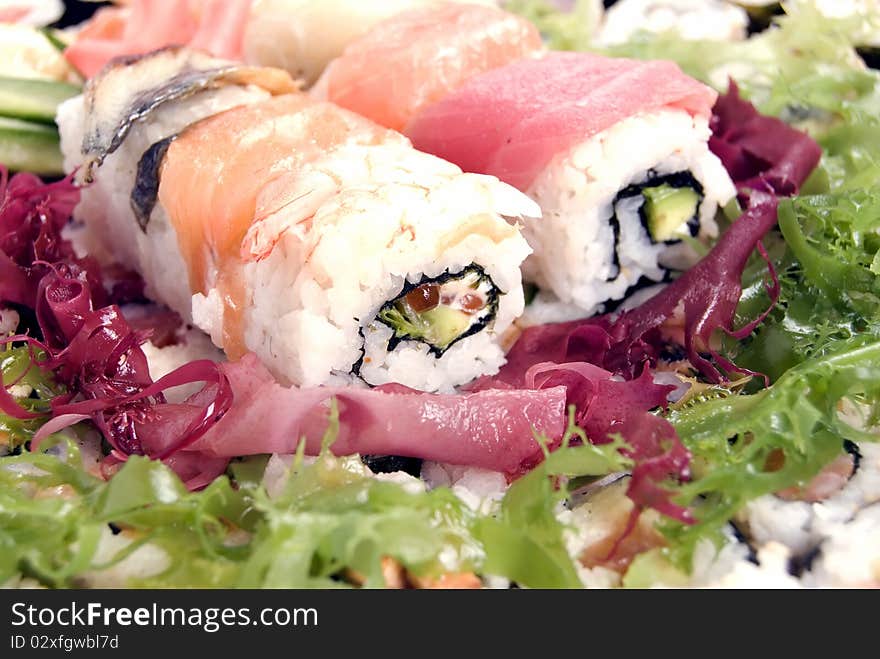 Portion of rolls served on the salad. Portion of rolls served on the salad