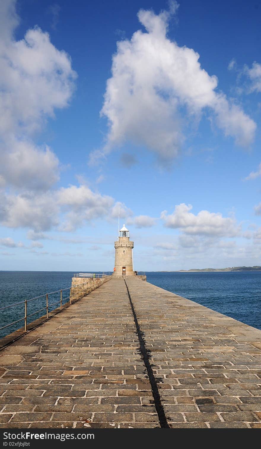 Harbour wall stretching out to sea at St Peter Port, Guernsey. Harbour wall stretching out to sea at St Peter Port, Guernsey