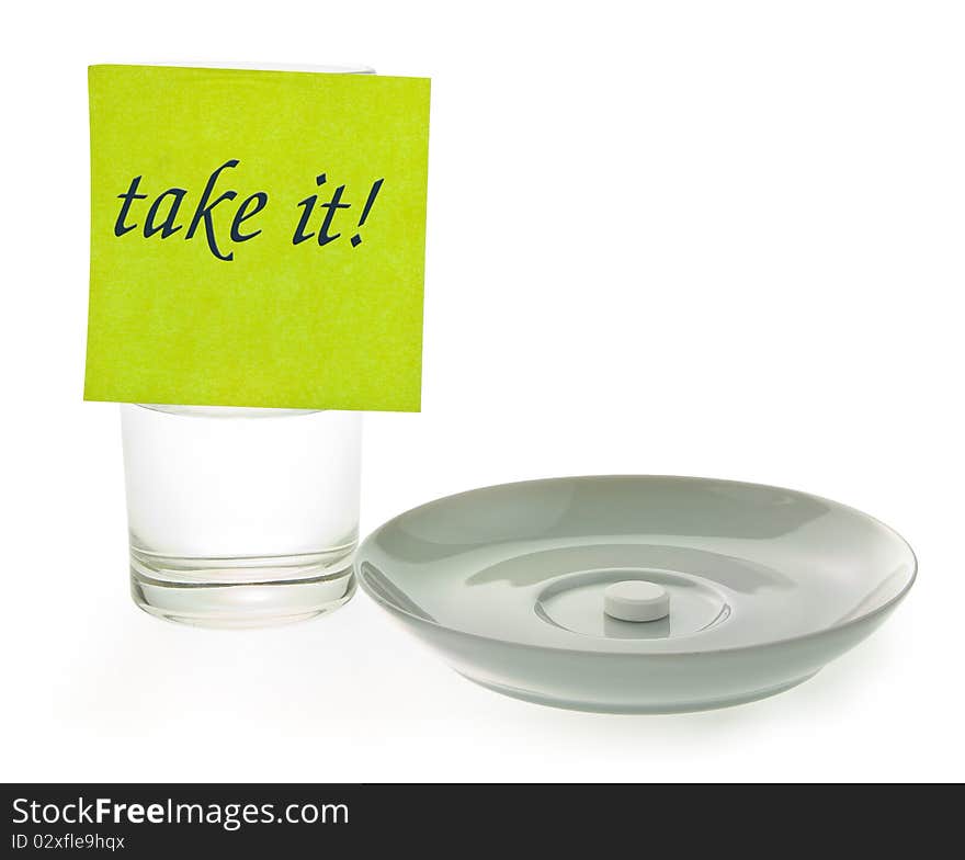 Tablet on the saucer and cup with liquid. Tablet on the saucer and cup with liquid