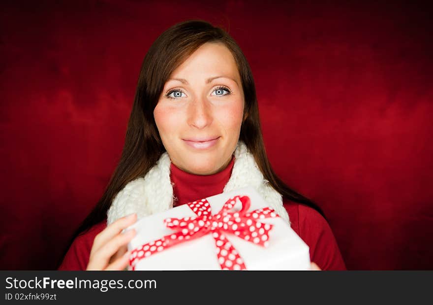 Happy girl holding present gift. Happy girl holding present gift