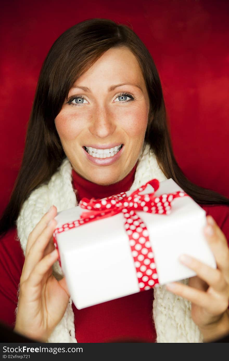 Happy girl holding present gift. Happy girl holding present gift