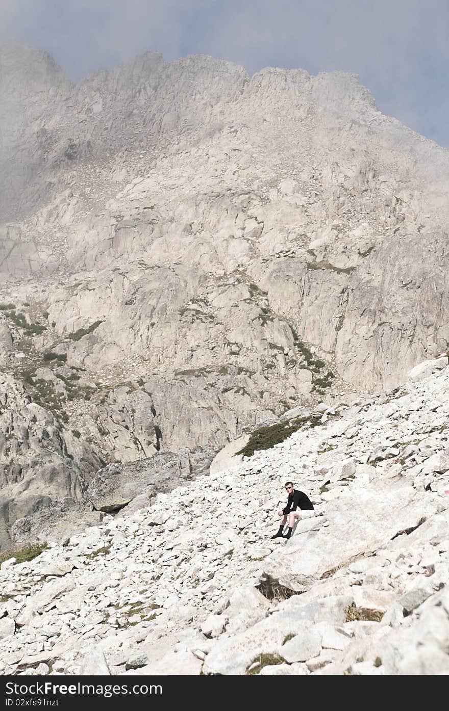 Person hiking the famous path GR20 at Corsica. Person hiking the famous path GR20 at Corsica.