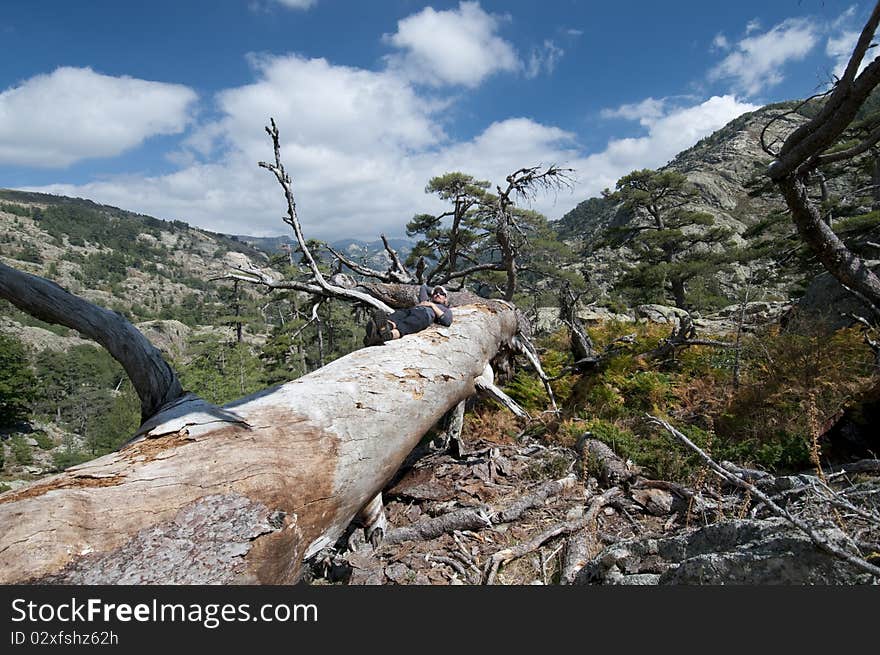 Person hiking the famous path GR20 at Corsica. Person hiking the famous path GR20 at Corsica.