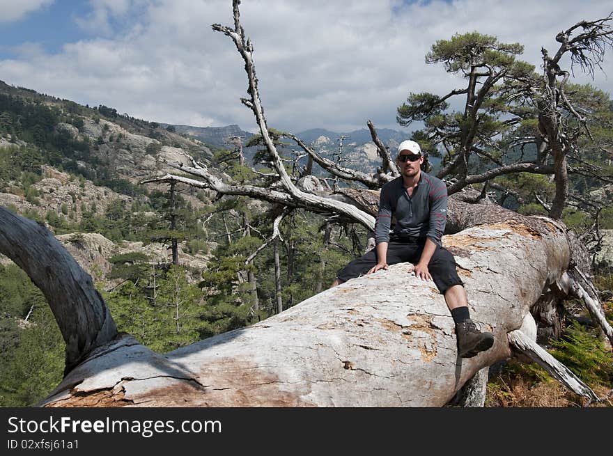 Person hiking the famous path GR20 at Corsica. Person hiking the famous path GR20 at Corsica.