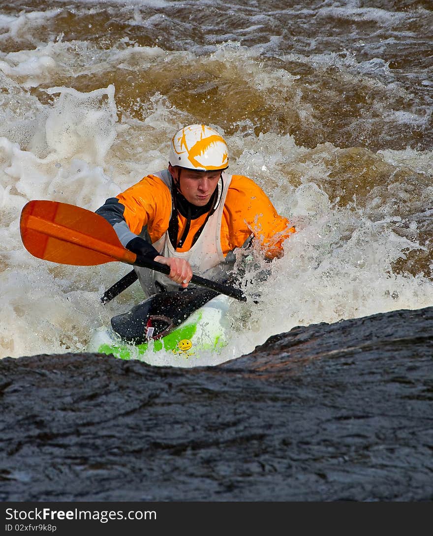 Acrobatic freestyle on whitewater in kayak