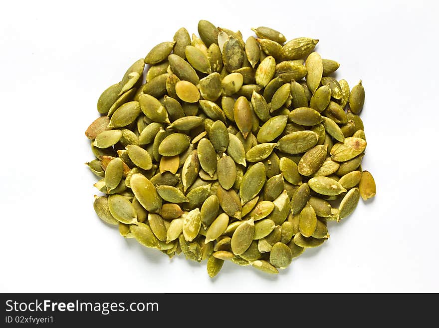 Roasted Pumpkin Kernels isolated on white background