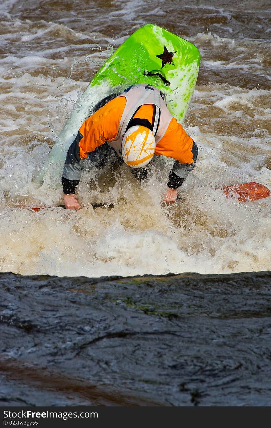 Acrobatic freestyle on whitewater in kayak