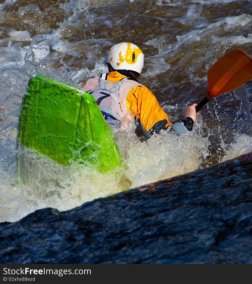 Acrobatic freestyle on whitewater in kayak