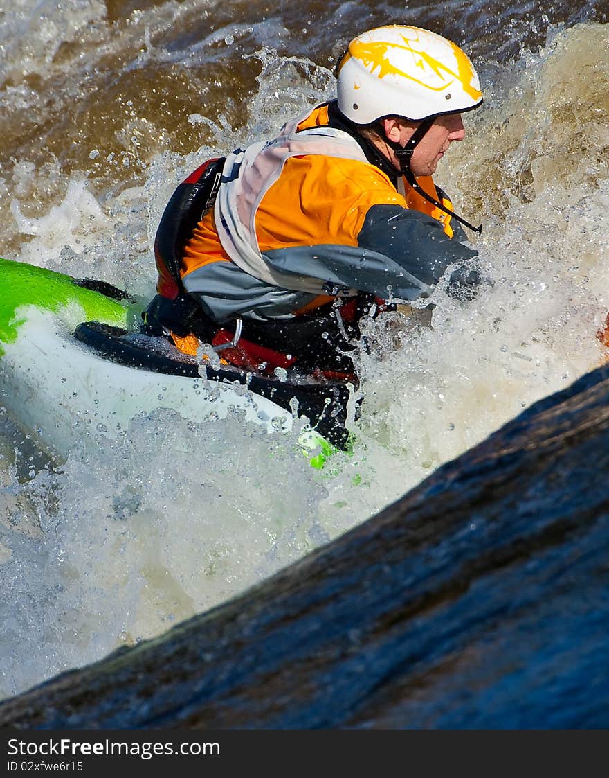 Acrobatic freestyle on whitewater in kayak