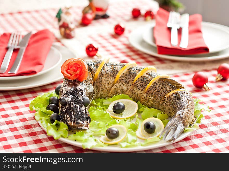 Decorated stuffed fish with New year background. Decorated stuffed fish with New year background