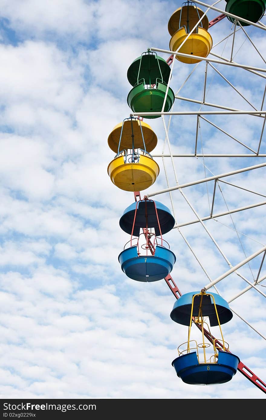 Ferris wheel on sky background