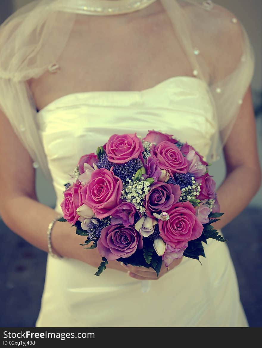 Bride showing her wedding boquet.