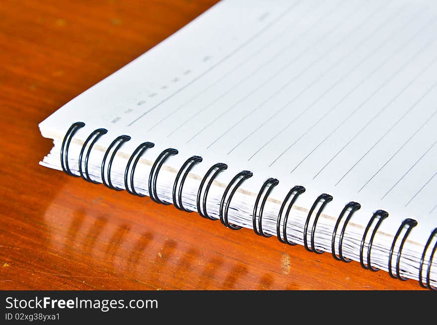 Close up of Spiral notebook on the wood background