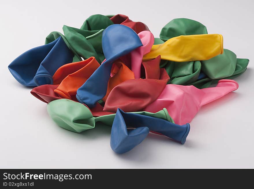 Inflatable balls of different colour from latex on a white background.