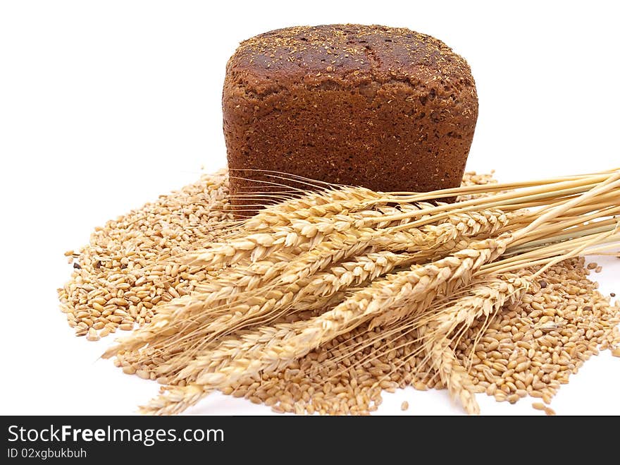 Bread with wheat and ears on white