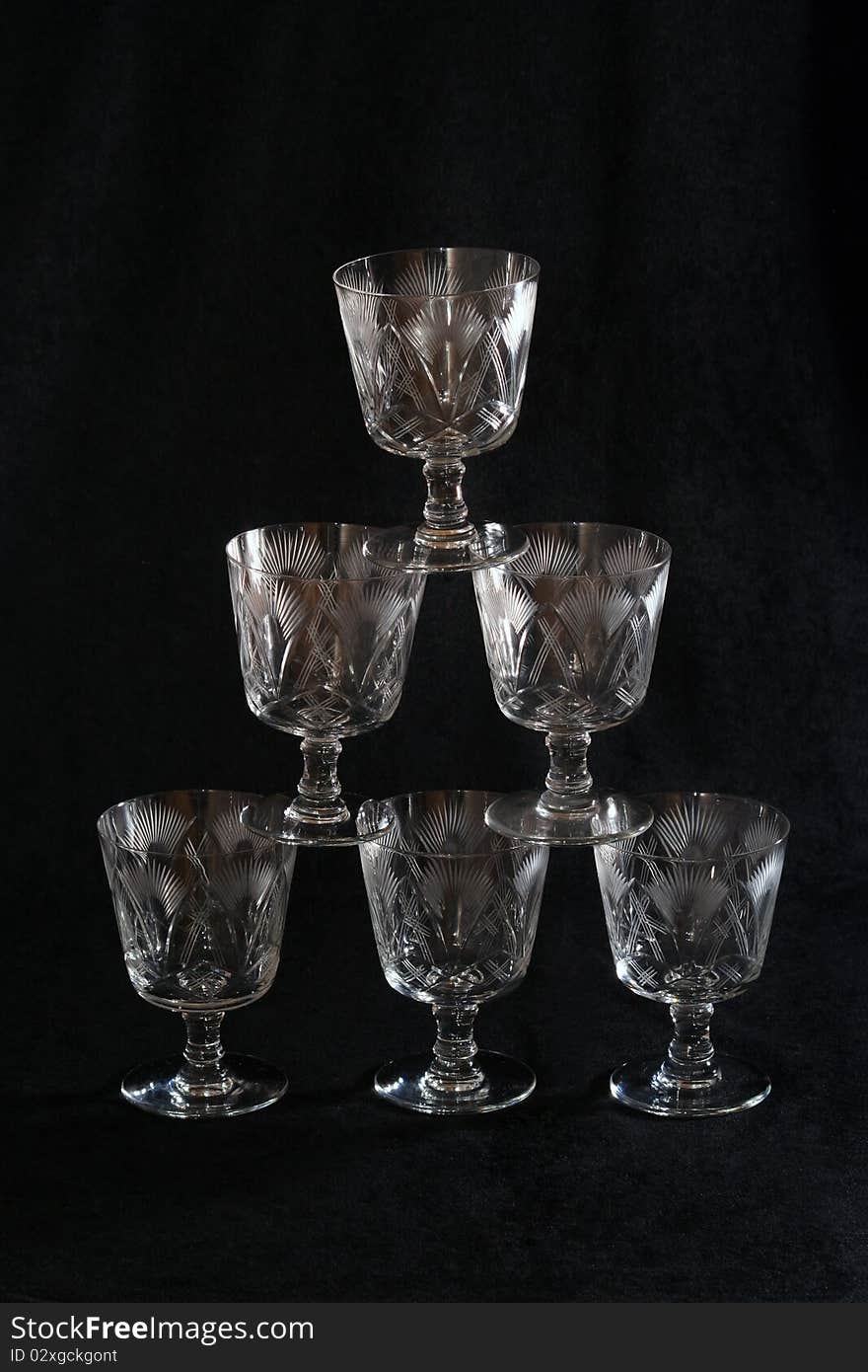 Pyramid of glasses over a black background