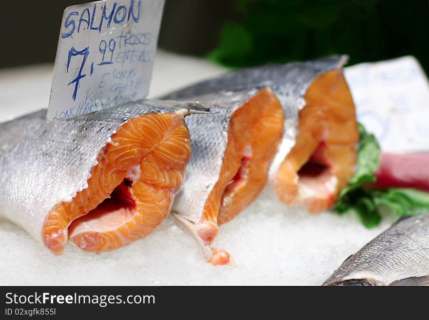 Fresh salmon in ice at the market