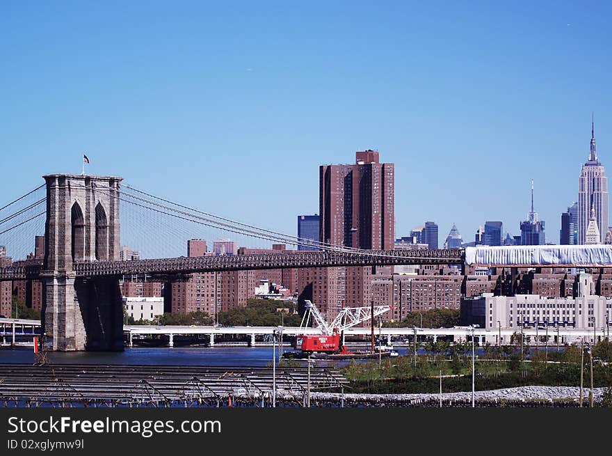 Brooklyn Bridge from brooklyn promnade in sunny day