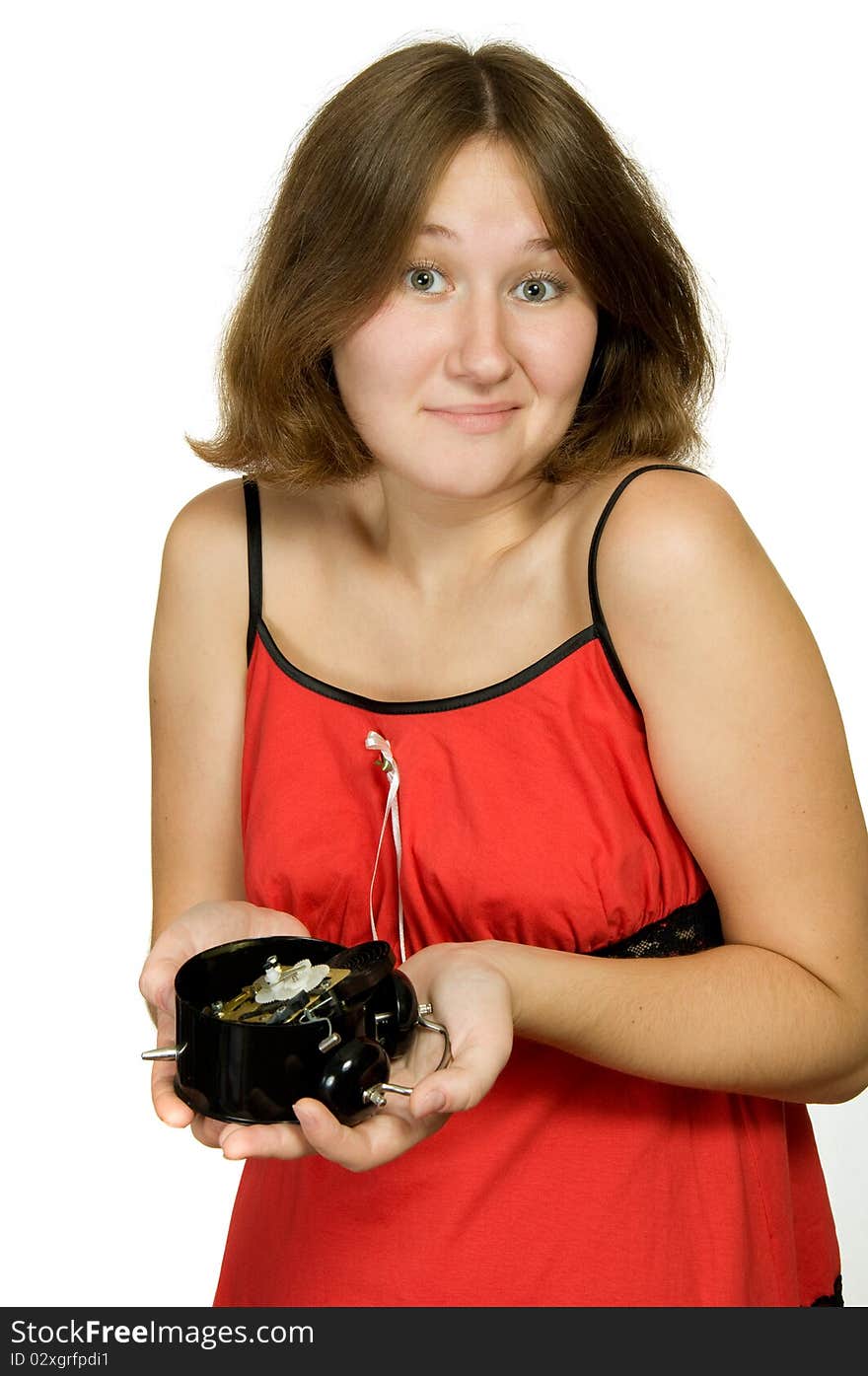 Astonished woman with broken alarm-clock over white. Astonished woman with broken alarm-clock over white