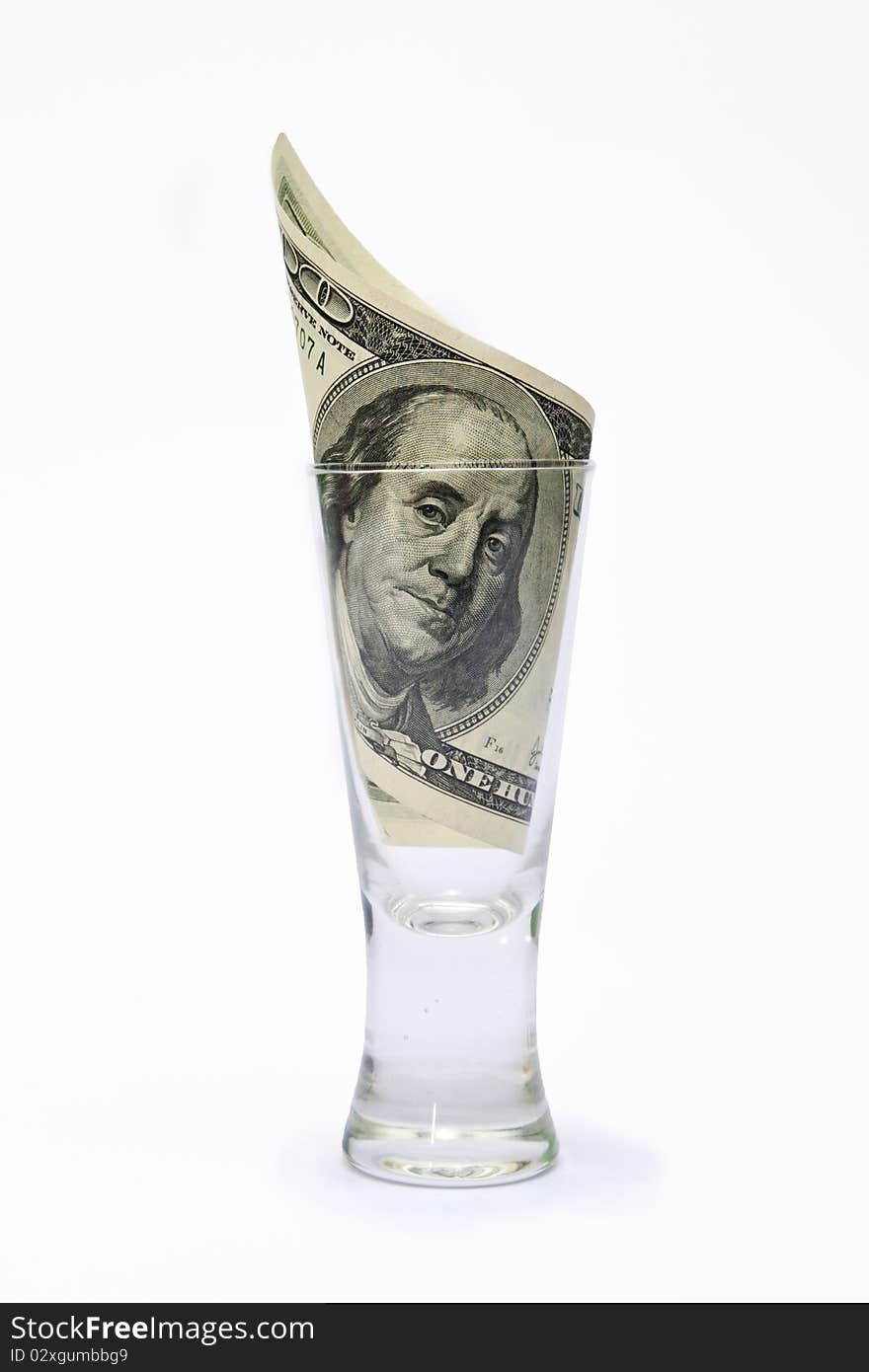 Dollar in glass on white background