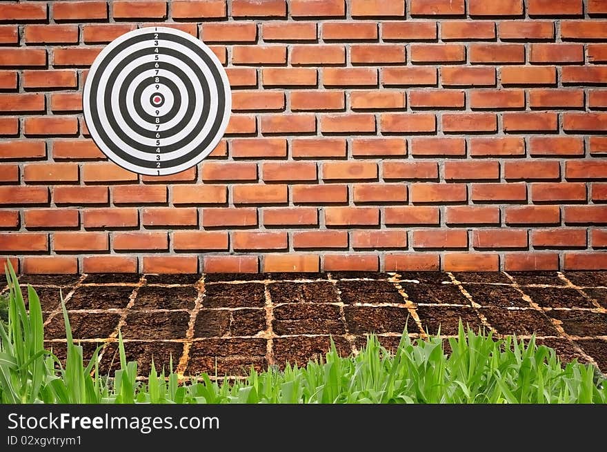 Target on brickwall pattern background