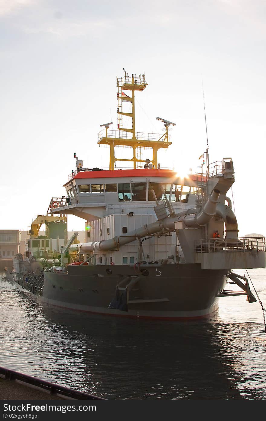 A trailing suction hopper dredger. A trailing suction hopper dredger