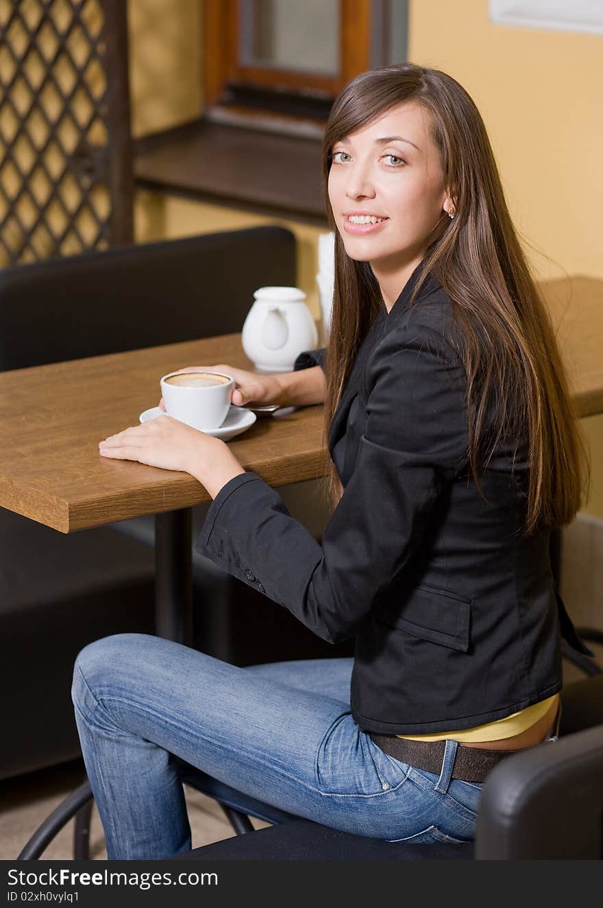 Beautiful girl with cup of coffee