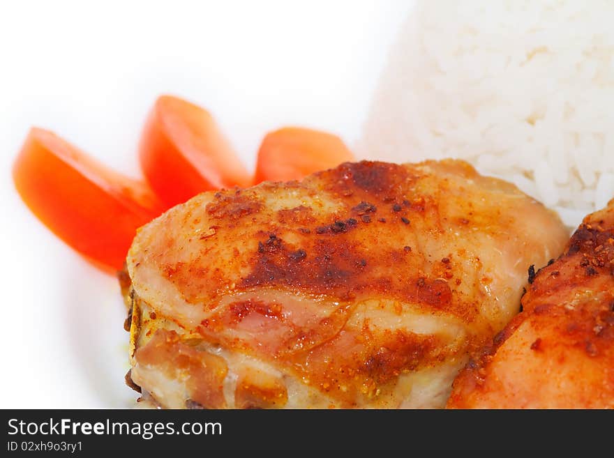 Roasted chiken thighs, rice and tomato