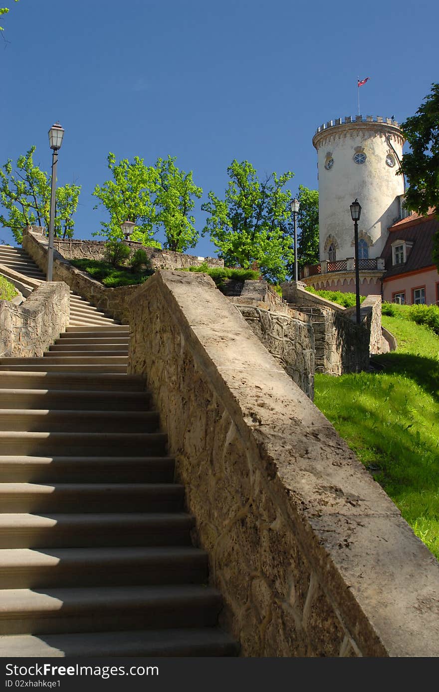 Stone stairs to round tower with flag. Stone stairs to round tower with flag