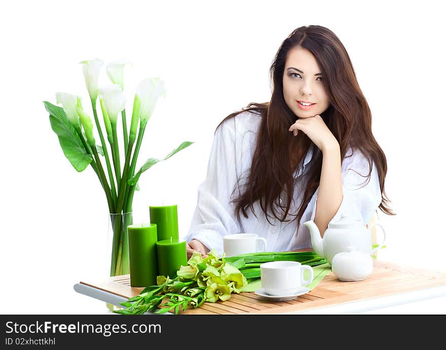 Beautiful woman in cafe over white background with flowers. Beautiful woman in cafe over white background with flowers