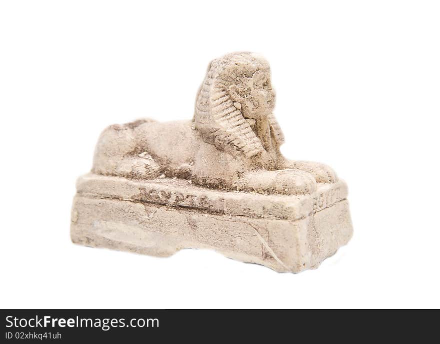 Gypsum statue of a sphinx on a white background