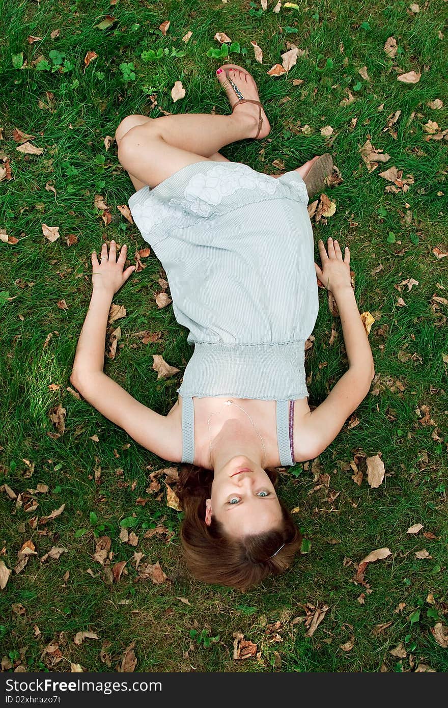 Girl Lying Down Of Grass