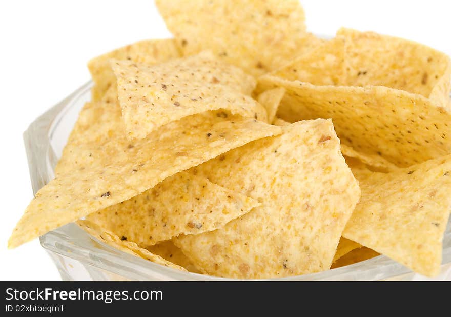 Tortilla chips isolated on white background in vase closeup.