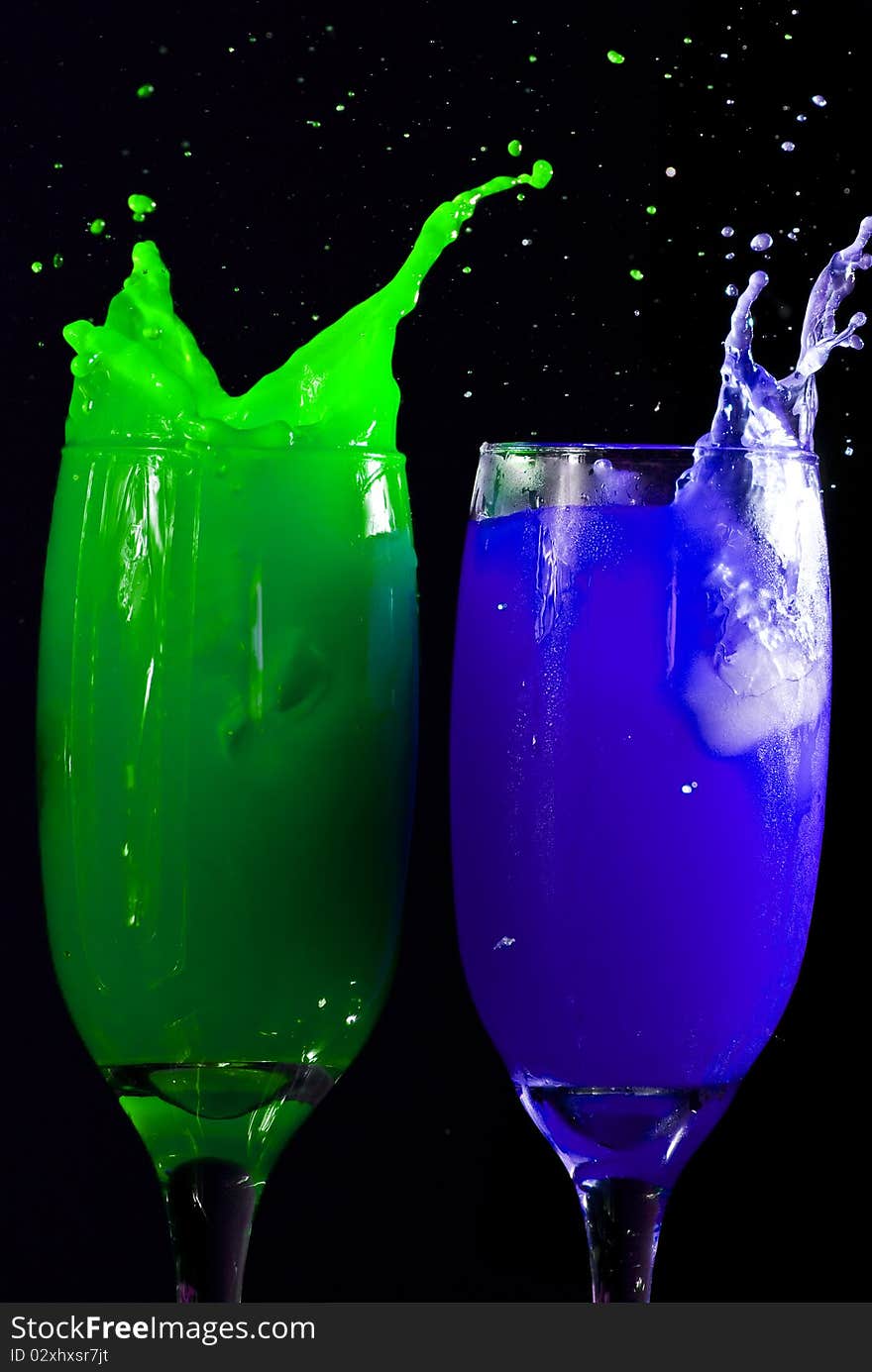 Colored drinks on black background. Colored drinks on black background