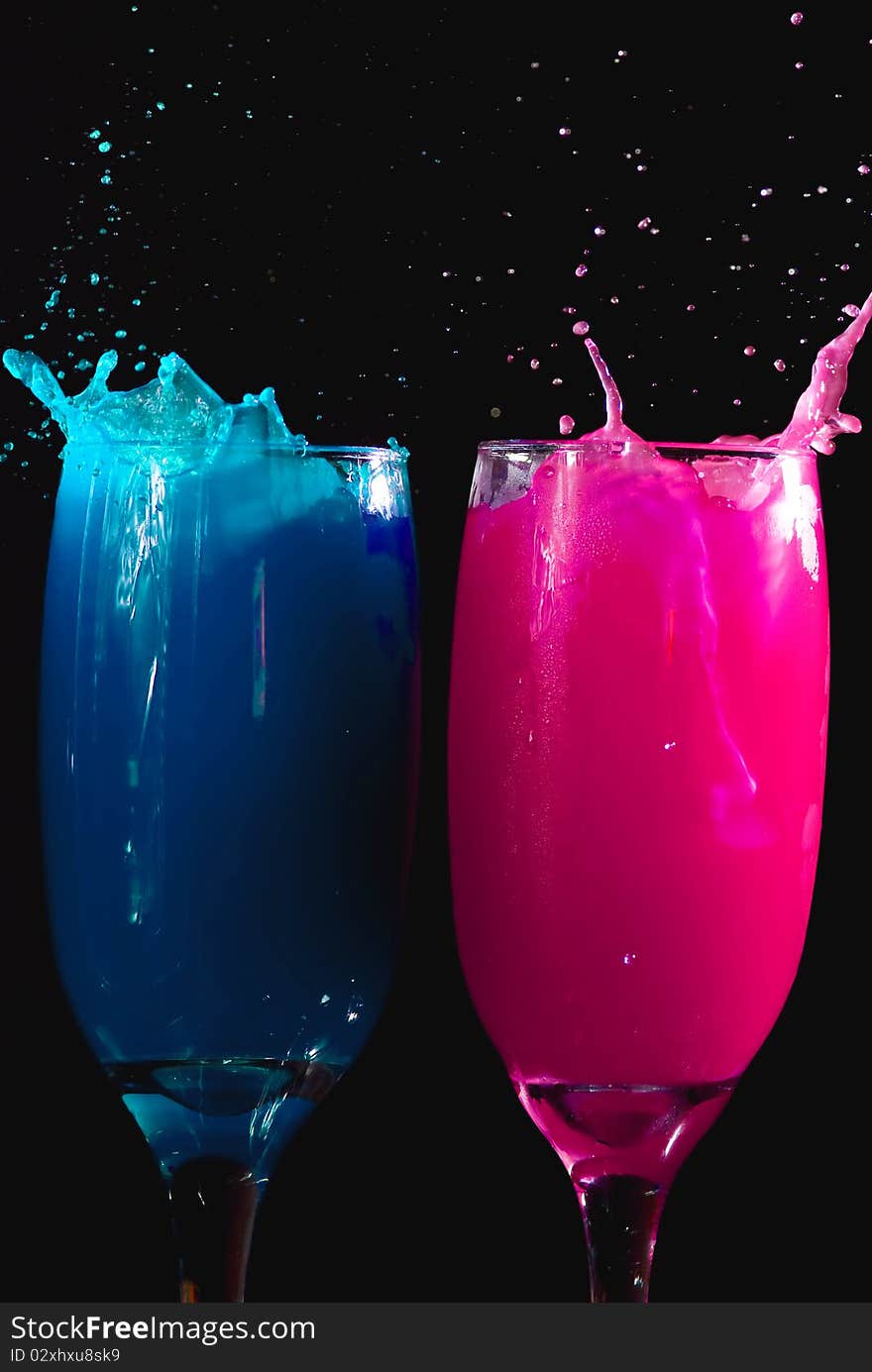 Colored drinks on black background. Colored drinks on black background