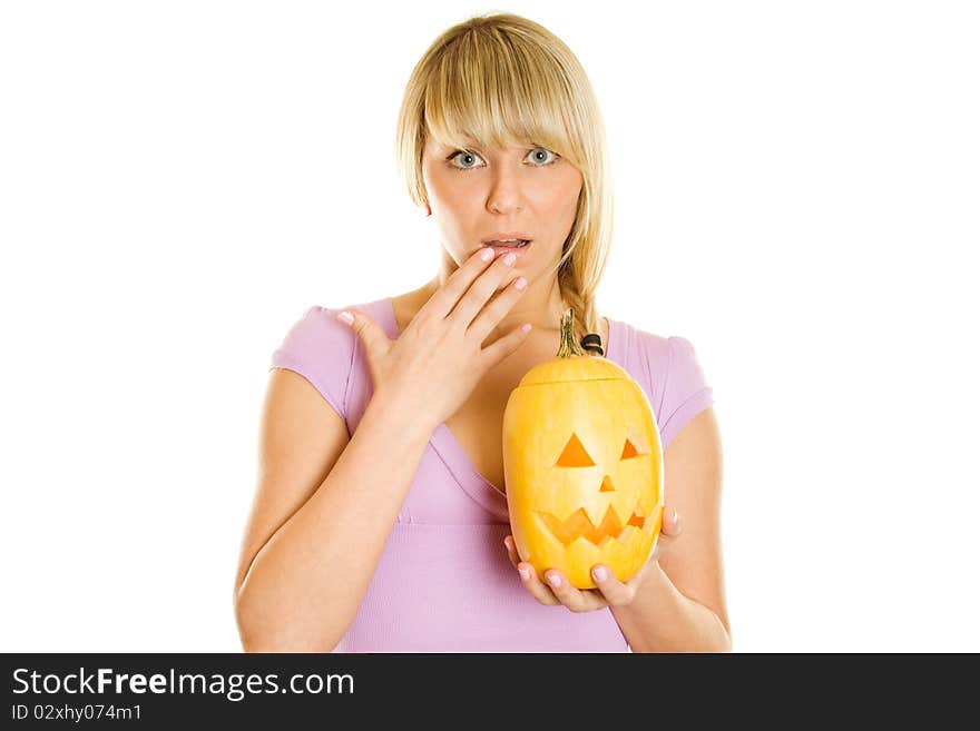 A young girl frightened with pumpkin for Halloween. Lots of copyspace and room for text on this isolate